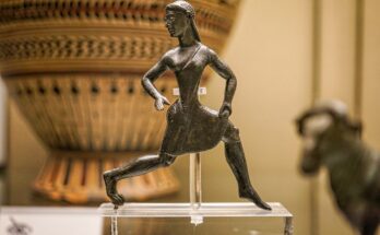 bronze running Spartan woman statue