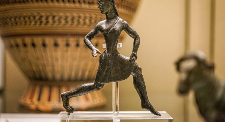 bronze running Spartan woman statue