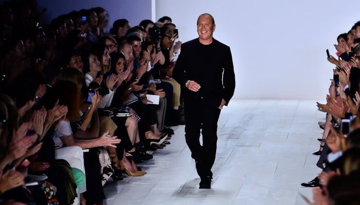 Michael Kors on the catwalk od his Spring Summer 2014 collection