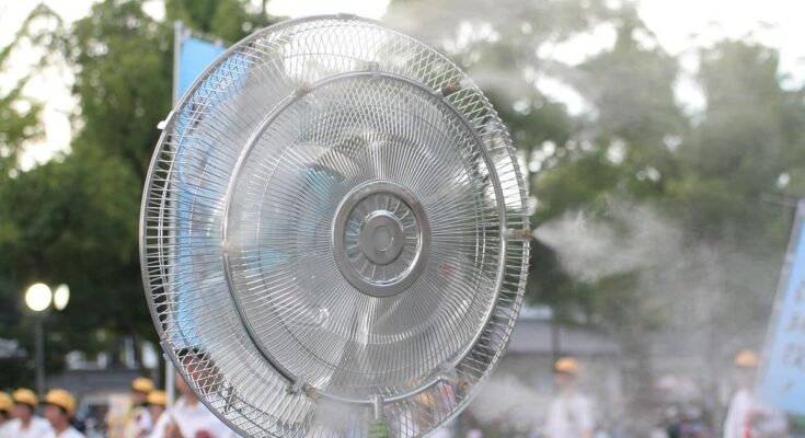 Outdoor fan spraying water