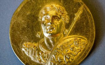 Gold medallion of man