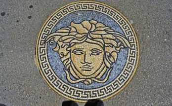 A mosaic of Medusa embedded in a pavement, symbol of Versace , inspired by Greek mythology