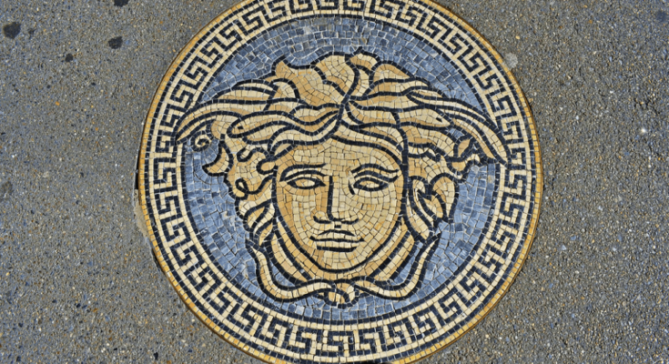 A mosaic of Medusa embedded in a pavement, symbol of Versace , inspired by Greek mythology