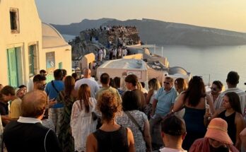 Tourists queueing for Santorini sunset.