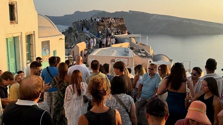 Tourists queueing for Santorini sunset.