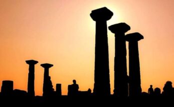 Ruins of the ancient Greek city of Assos, showcasing the remnants of its historical structures against a scenic backdrop.