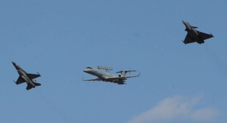 An F-16 Viper and a Rafale fighter jet performing an aerial maneuver during Athens Flying Week 2024 at Tanagra Air Base.