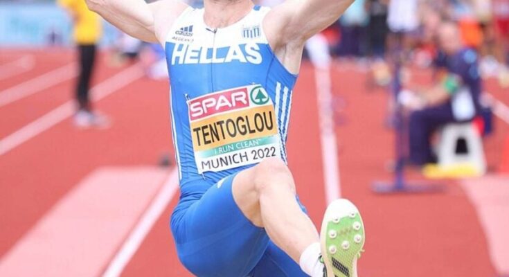 Miltos Tentoglou in mid-air during a jump,