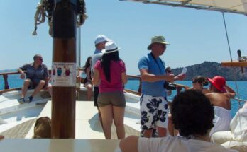 A group of tourists heading for the Volcano of Santorini.