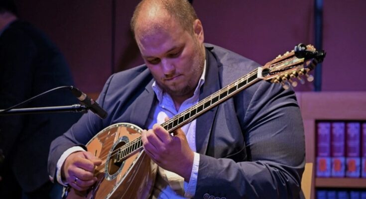 Michael Paouris playing Greek music with his bouzouki