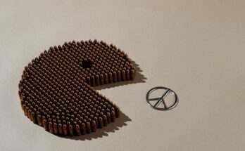 In this image we see bullets forming a Packman trying to eat peace