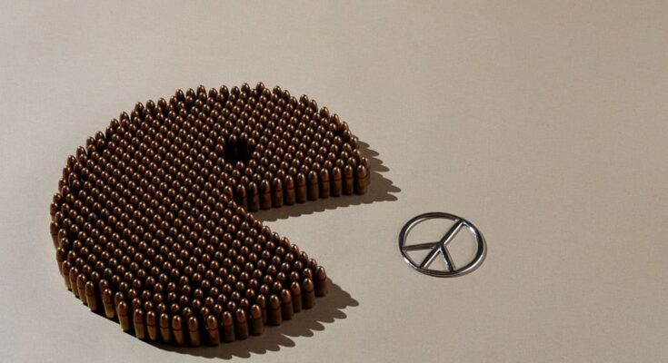 In this image we see bullets forming a Packman trying to eat peace